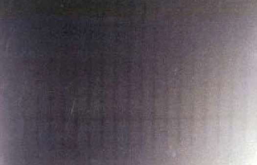 Steel strip surface showing faint regular transverse marks caused by fifth octave chatter
