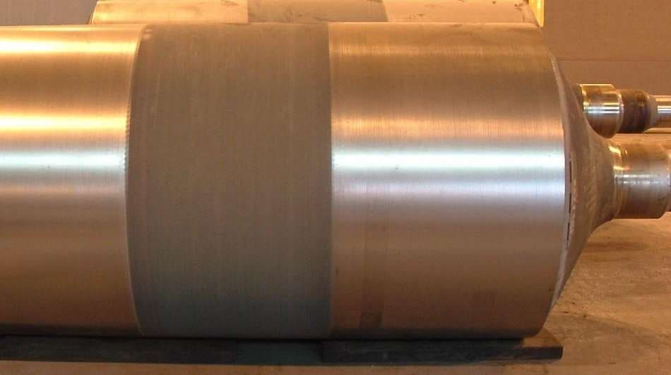 Photograph of a furnace roll showing increased surface roughness in the flat centre region