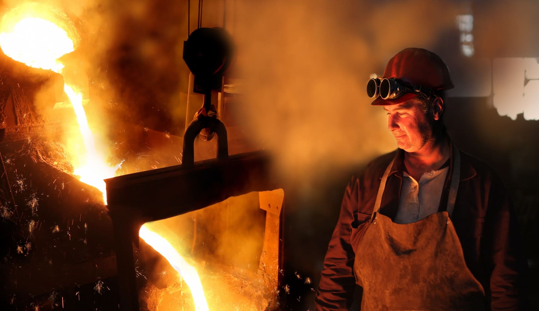 Steelworker controlling an iron smelting furnace