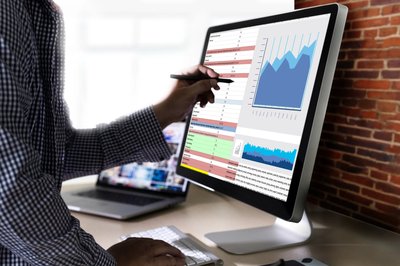 Business analyst reviewing steel cost data