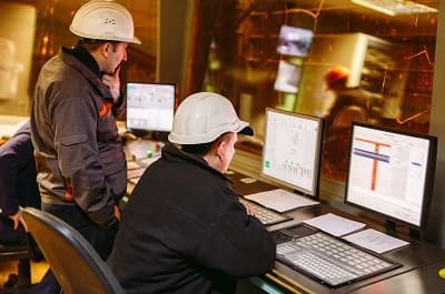 Modern steel plant control room with automated monitoring systems and process control displays